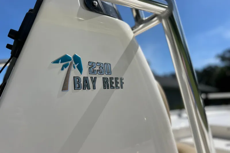 Slide: The Image of Close-up of 2020 Key West 230 Bay Reef boat logo in sunlight. - 19