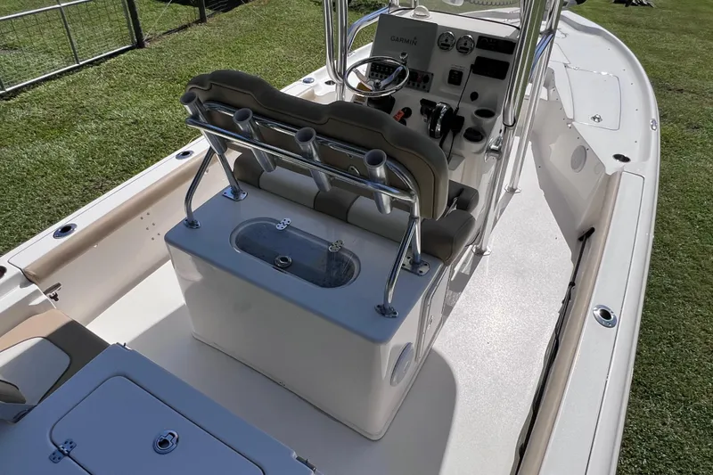 Slide: The Image of 2020 Key West 230 Bay Reef boat interior with seating and control panel. - 26