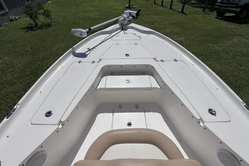 Slide: The Image of 2020 Key West 230 Bay Reef boat deck with storage compartments and trolling motor. - 36