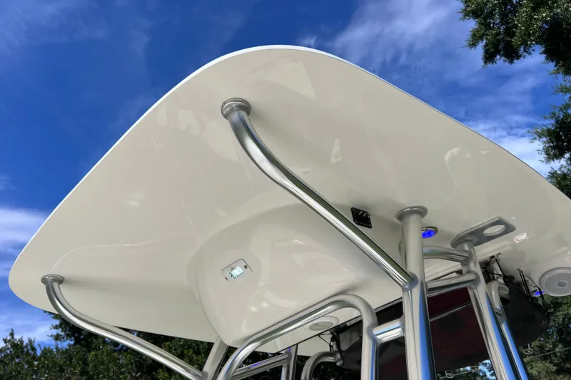 Slide: The Image of 2020 Key West 230 Bay Reef boat T-top against blue sky background. - 45