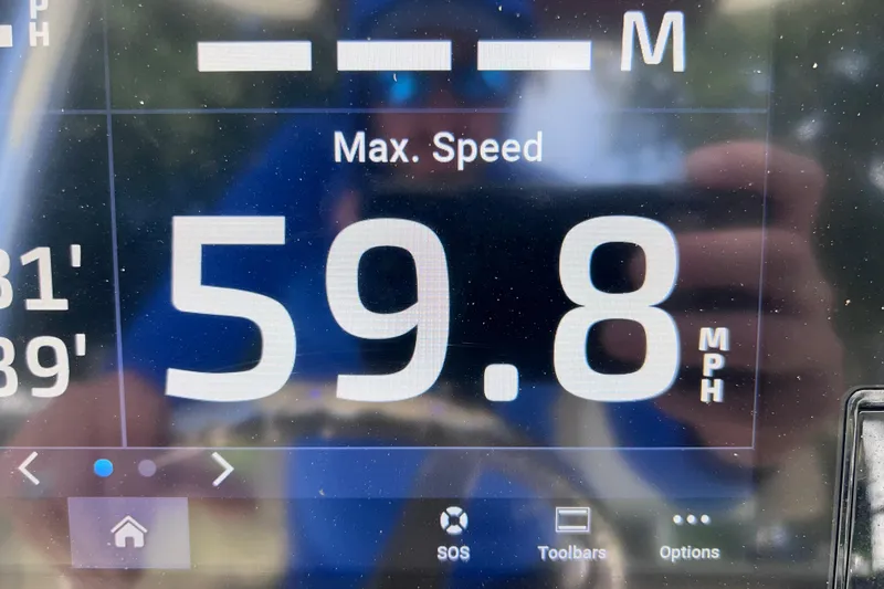 Slide: The Image of Digital display showing max speed of 59.8 MPH on Key West 230 Bay Reef. - 52