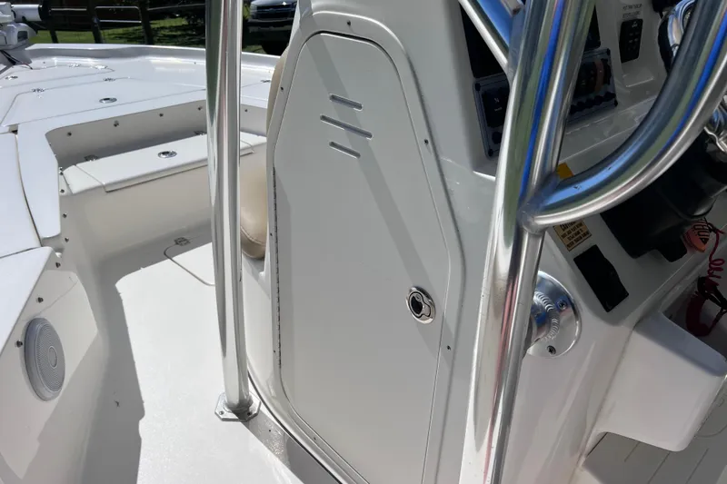 Slide: The Image of 2020 Key West 230 Bay Reef boat interior with console and seating area. - 60