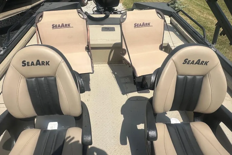 Slide: The Image of 2026 SeaArk EasyCat boat interior with four beige and black seats. - 5
