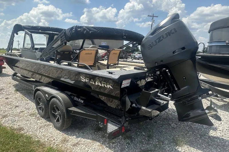 Slide: The Image of 2026 SeaArk EasyCat boat with Suzuki outboard motor on a trailer, parked outdoors. - 8