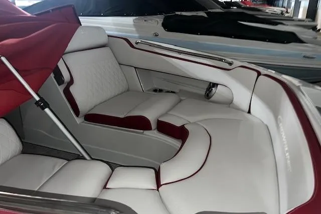 Slide: The Image of 2023 Crownline E255 boat interior with white and red seating, showcasing luxury design. - 7