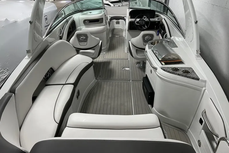 Slide: The Image of 2023 Crownline E285 boat interior with luxurious seating and modern amenities. - 7