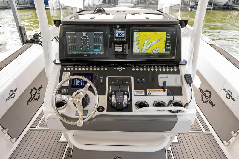 Slide: The Image of Cockpit of 2018 Fountain 38 SCX boat with advanced navigation and control systems. - 11