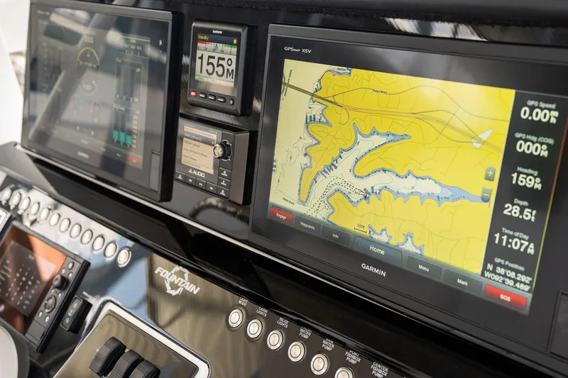 Slide: The Image of Dashboard of 2018 Fountain 38 SCX boat with Garmin navigation displays. - 12