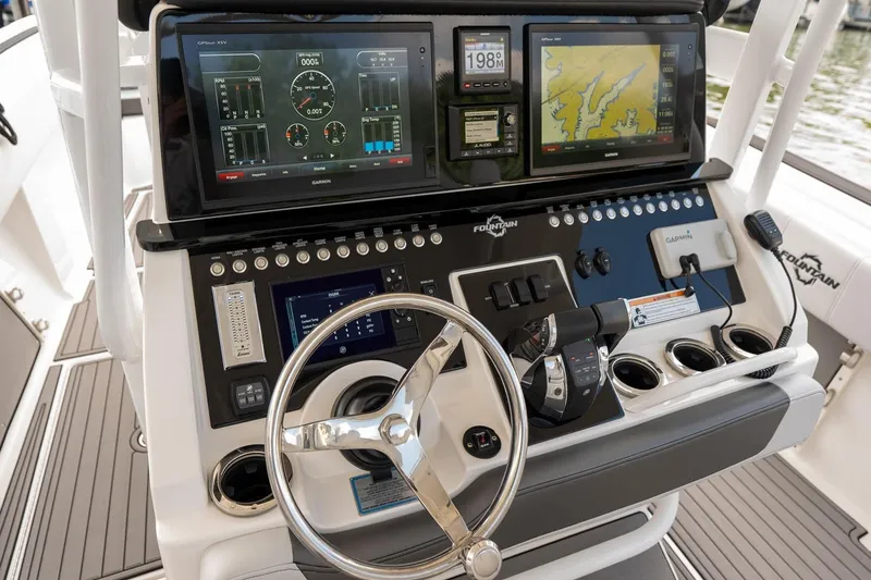 Slide: The Image of 2018 Fountain 38 SCX boat dashboard with advanced navigation and control systems. - 17