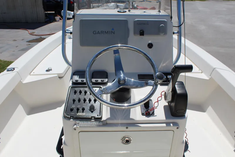 Slide: The Image of 2015 Pathfinder 2200 boat console with Garmin navigation and steering wheel. - 11