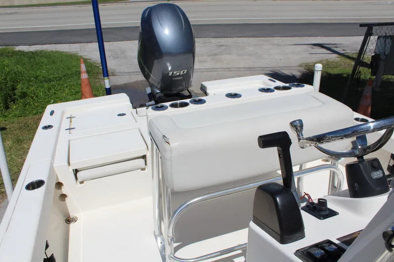 Slide: The Image of 2015 Pathfinder 2200 boat interior with Yamaha 150 engine, steering wheel, and control panel. - 14
