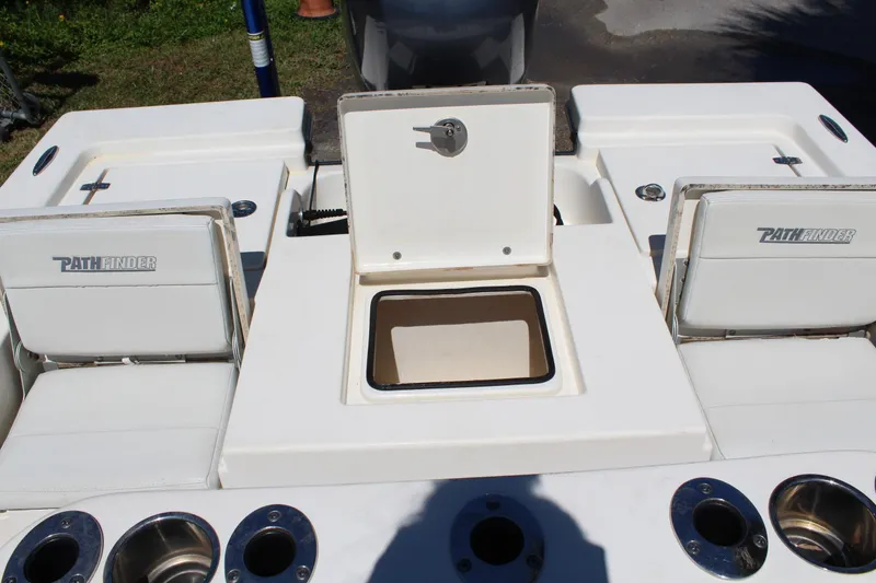 Slide: The Image of 2015 Pathfinder 2200 boat interior with open storage compartment and seating. - 15