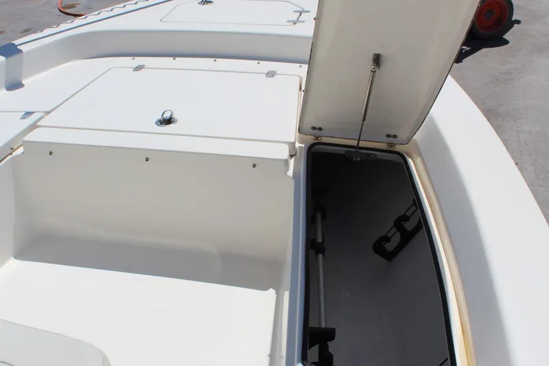 Slide: The Image of 2015 Pathfinder 2200 boat storage compartment with open hatch, showcasing interior space. - 19