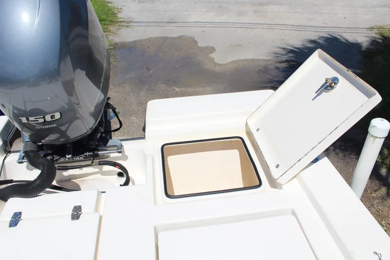 Slide: The Image of 2015 Pathfinder 2200 boat with Yamaha 150 engine and open storage compartment. - 23