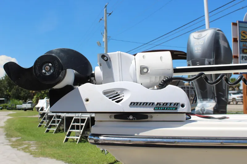Slide: The Image of Minn Kota Riptide trolling motor on 2015 Pathfinder 2200 boat, sunny day, outdoor setting. - 3