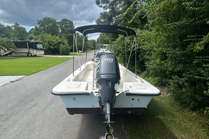 Slide: The Image of 2010 Southern Skimmer 19SS boat with outboard motor on a driveway. - 7