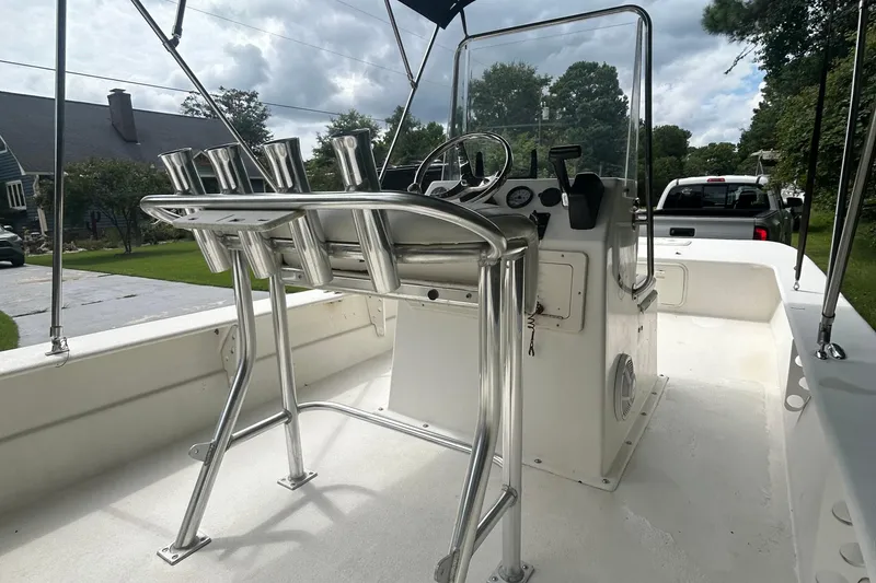 Slide: The Image of 2010 Southern Skimmer 19SS boat interior with steering console and rod holders. - 8