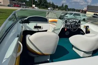 Slide: The Image of 1996 Baja 188 Islander 25th Anniversary boat with yellow and white exterior. - 1