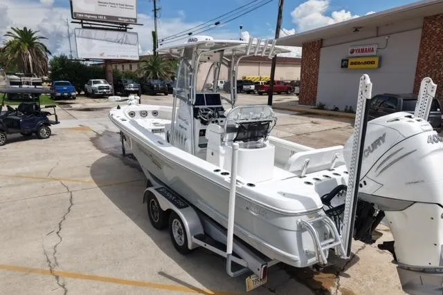 Slide: The Image of 2021 BlackJack 256 Bay boat on trailer, parked outside a dealership. - 5