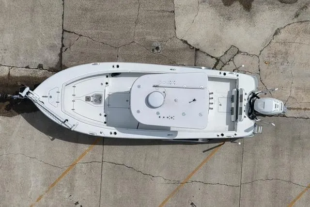 Slide: The Image of Aerial view of 2021 BlackJack 256 Bay boat on concrete surface. - 7