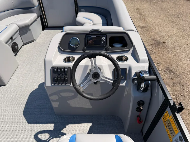 Slide: The Image of 2025 Bentley Pontoons Bolt 223 dashboard with steering wheel and control panel. - 19