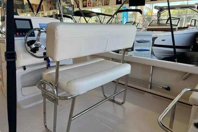 Slide: The Image of 2023 Grady White Fisherman 180 boat interior with white seating and steering console. - 3