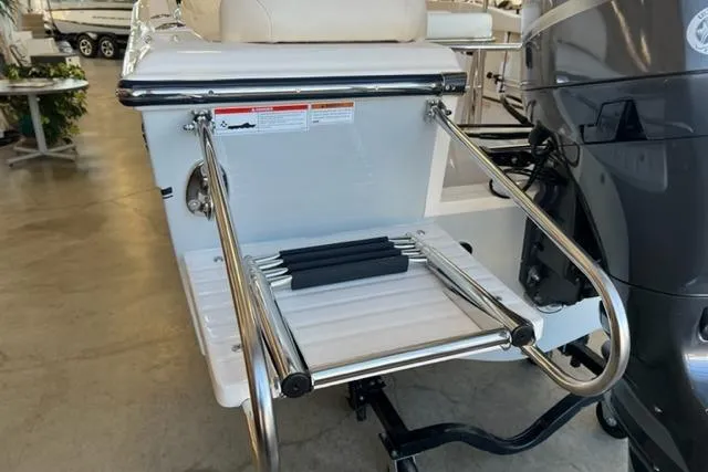 Slide: The Image of 2023 Grady White Fisherman 180 boat with stainless steel swim ladder and outboard motor. - 4