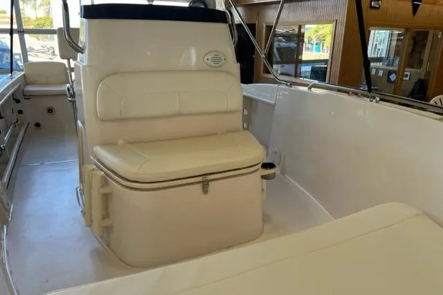 Slide: The Image of 2023 Grady White Fisherman 180 boat interior with cushioned seating and storage. - 6