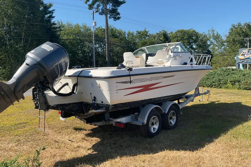 Slide: The Image of 1999 Hydra-Sports 230 SEA HOURSE WA boat on trailer, parked on grass. - 8