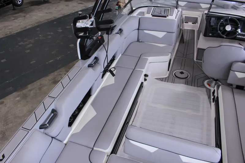 Slide: The Image of 2023 Moomba Makai boat interior with spacious seating and modern design. - 13