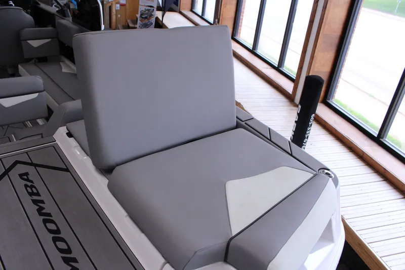 Slide: The Image of 2023 Moomba Makai boat interior with gray seating and modern design. - 27