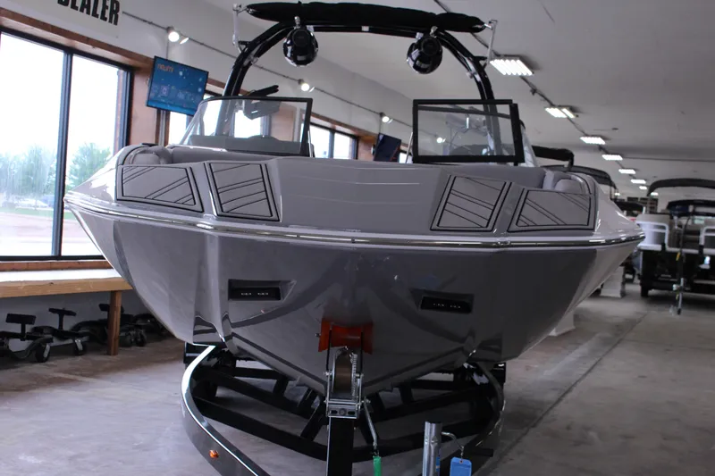 Slide: The Image of 2023 Moomba Makai boat displayed indoors, showcasing sleek design and modern features. - 3
