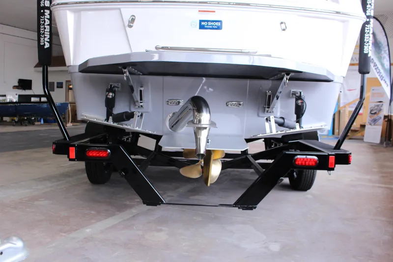 Slide: The Image of 2023 Moomba Makai boat on trailer, rear view showing propeller and exhaust system. - 5
