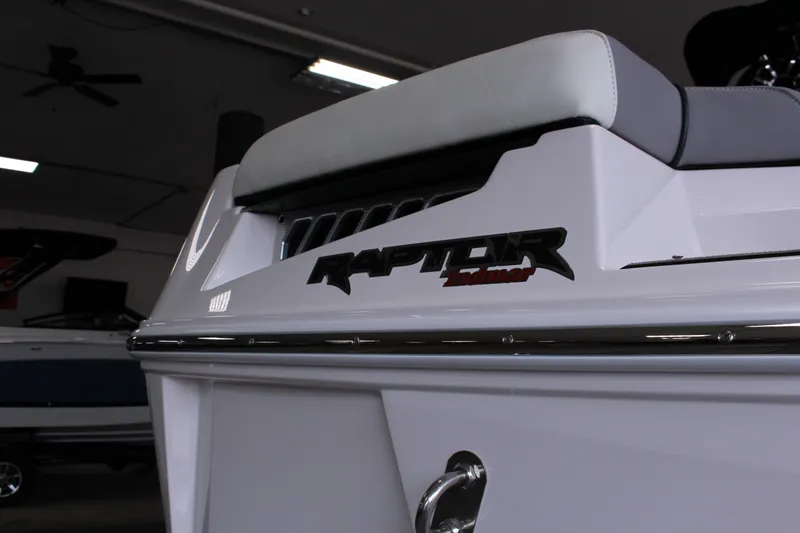 Slide: The Image of 2023 Moomba Makai boat with Raptor Indmar engine branding in a showroom. - 6