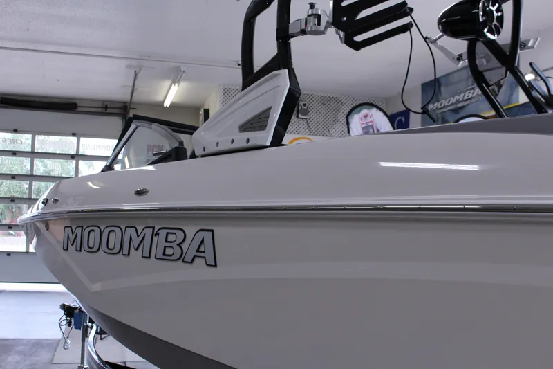 Slide: The Image of 2023 Moomba Makai boat in showroom, showcasing sleek design and branding. - 7