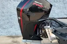 Slide: The Image of Outboard motor on a 2026 Phoenix 920 Elite X boat, featuring sleek black and red design. - 14