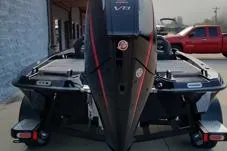 Slide: The Image of 2026 Phoenix 920 Elite X boat, rear view, parked outdoors. - 15