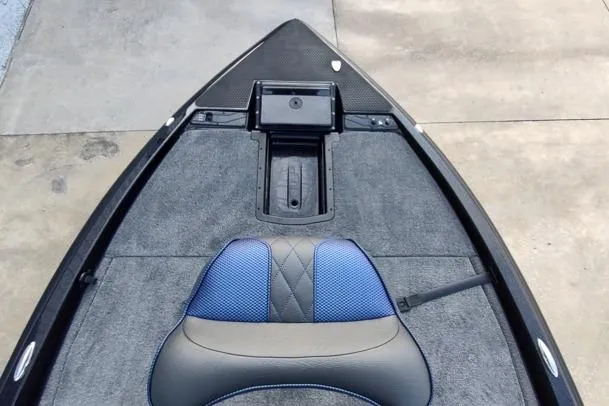 Slide: The Image of Front deck of 2026 Phoenix 920 Elite X boat with blue and black seating. - 3
