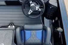 Slide: The Image of 2026 Phoenix 920 Elite X boat interior with steering wheel and blue-accented seat. - 6