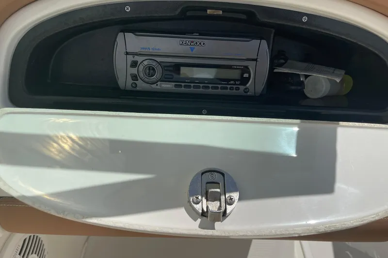 Slide: The Image of Kenwood stereo system in 2008 Chris-Craft Launch 25 boat compartment. - 16