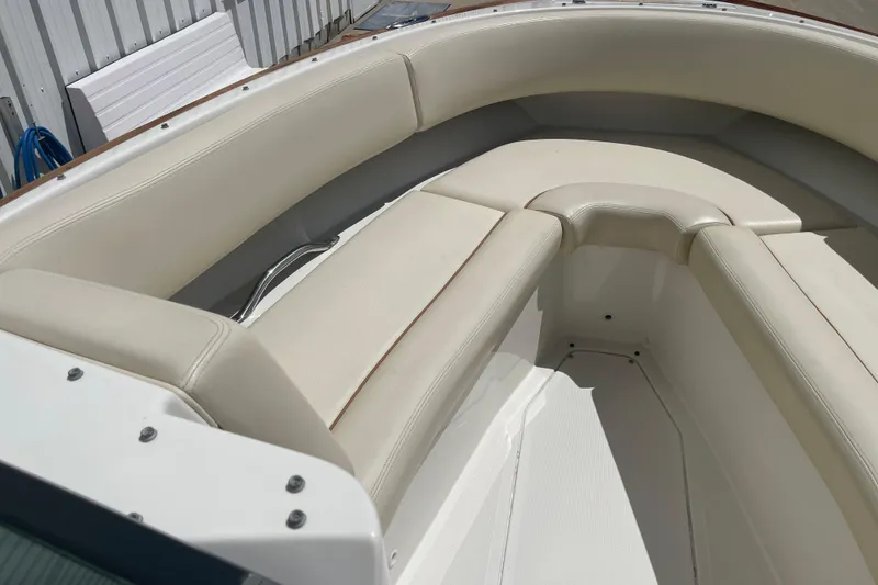 Slide: The Image of 2008 Chris-Craft Launch 25 boat interior with beige seating and sleek design. - 17