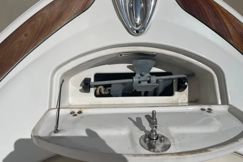 Slide: The Image of 2008 Chris-Craft Launch 25 anchor compartment with stainless steel fittings and wooden accents. - 19