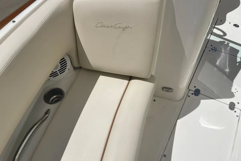 Slide: The Image of 2008 Chris-Craft Launch 25 boat interior with beige seating and cup holder. - 24