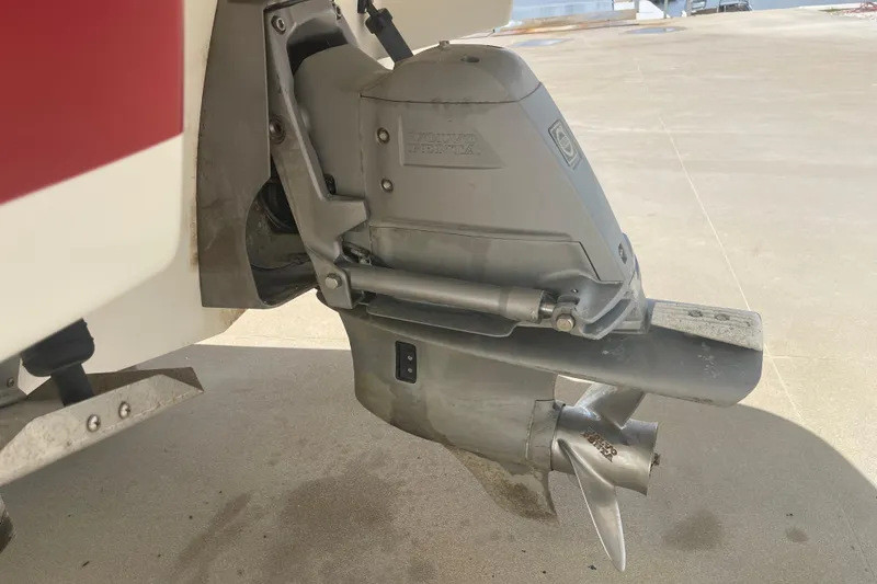 Slide: The Image of 2008 Chris-Craft Launch 25 boat engine with Volvo Penta outdrive on concrete surface. - 33