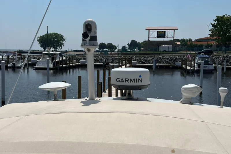 Slide: The Image of 2001 Cruisers Yachts 3672 Express with Garmin equipment docked at a marina. - 33