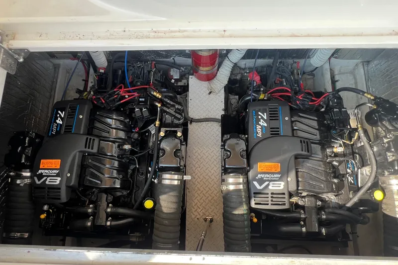 Slide: The Image of Twin Mercury V8 engines in a 2001 Cruisers Yachts 3672 Express engine compartment. - 35