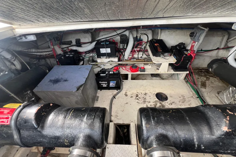 Slide: The Image of Engine room of 2001 Cruisers Yachts 3672 Express with batteries and wiring. - 38