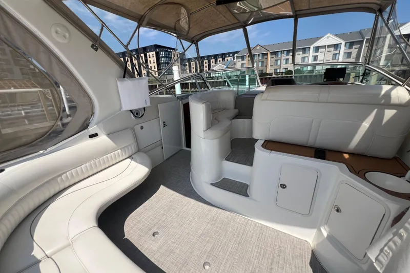Slide: The Image of 2001 Cruisers Yachts 3672 Express interior with white seating and modern design. - 7
