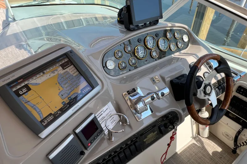 Slide: The Image of 2001 Cruisers Yachts 3672 Express helm with navigation system and gauges. - 9