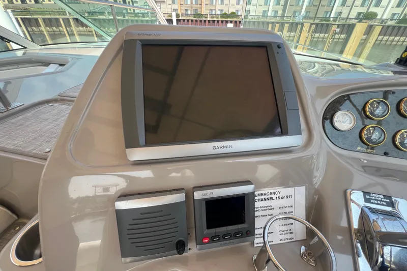 Slide: The Image of 2001 Cruisers Yachts 3672 Express helm with Garmin GPS and control panel. - 11